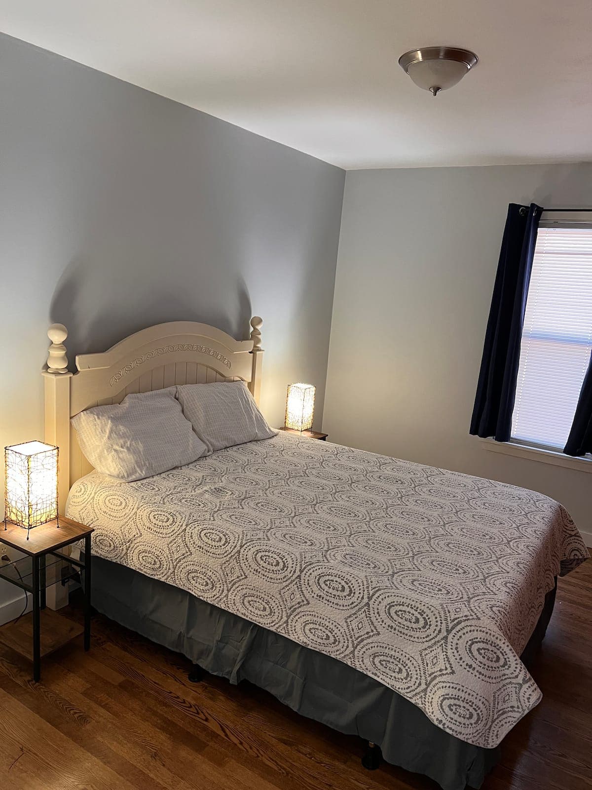 Bedroom with a cream headboard in Sparta Renovated 2-Bedroom