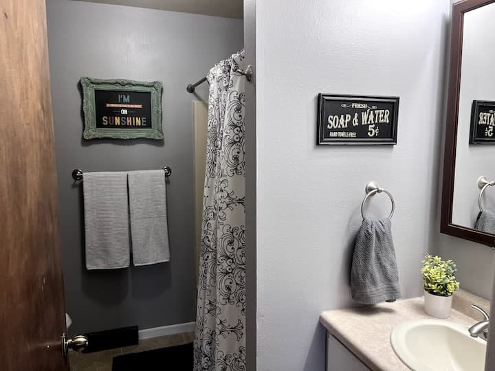 Bathroom with a bathtub and vanity