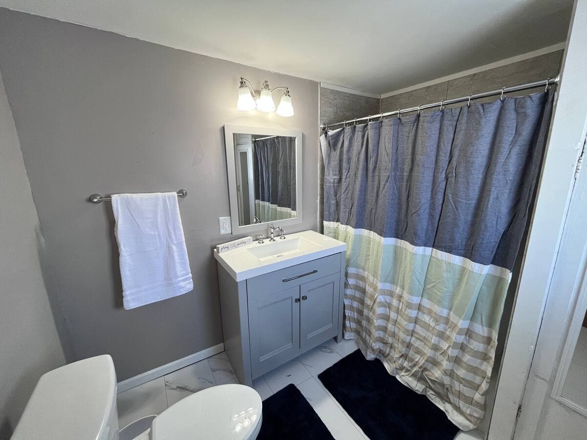 Bathroom with a vanity and shower in the Tomah 1-bedroom